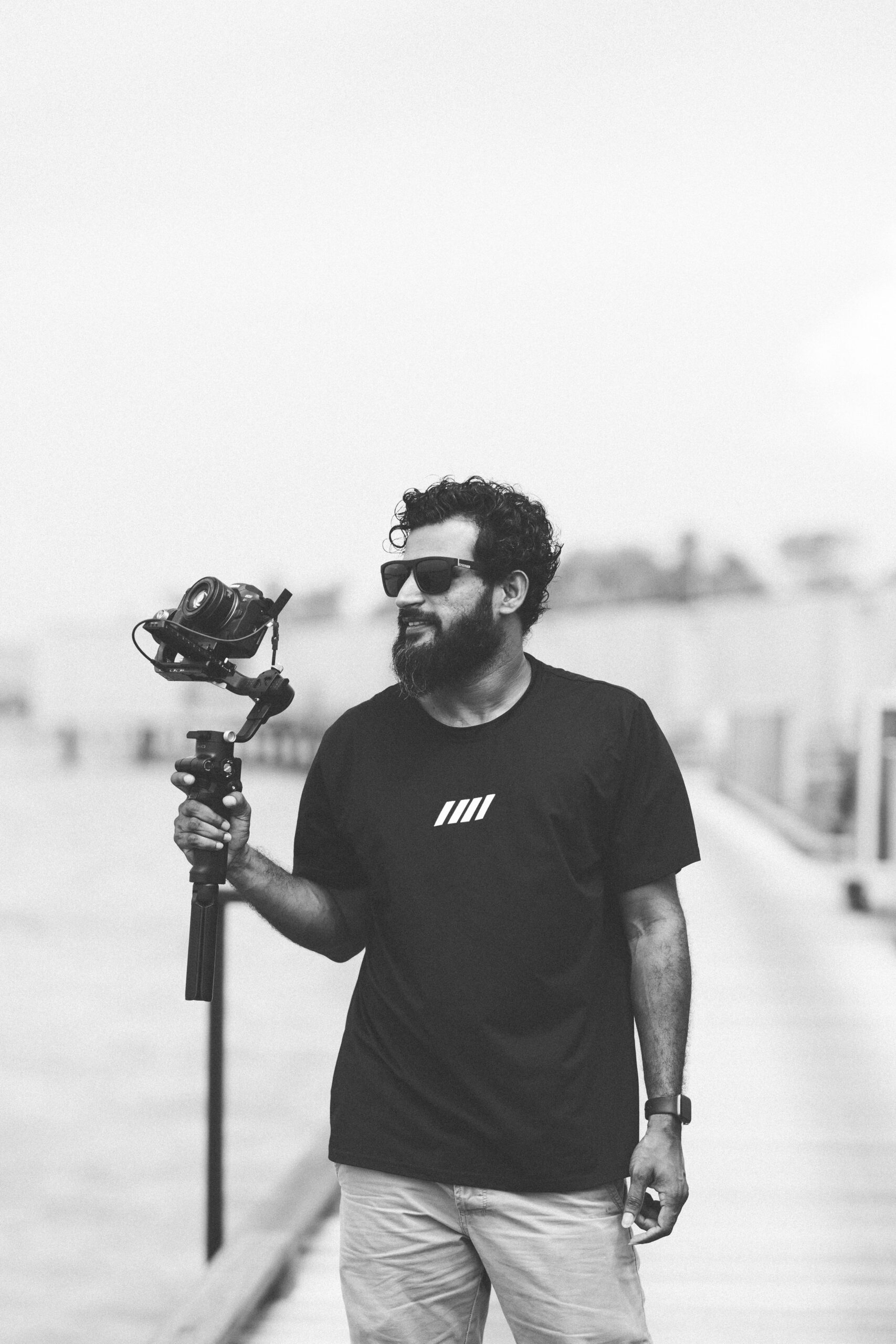 Maahid holding a camera on a gimbal